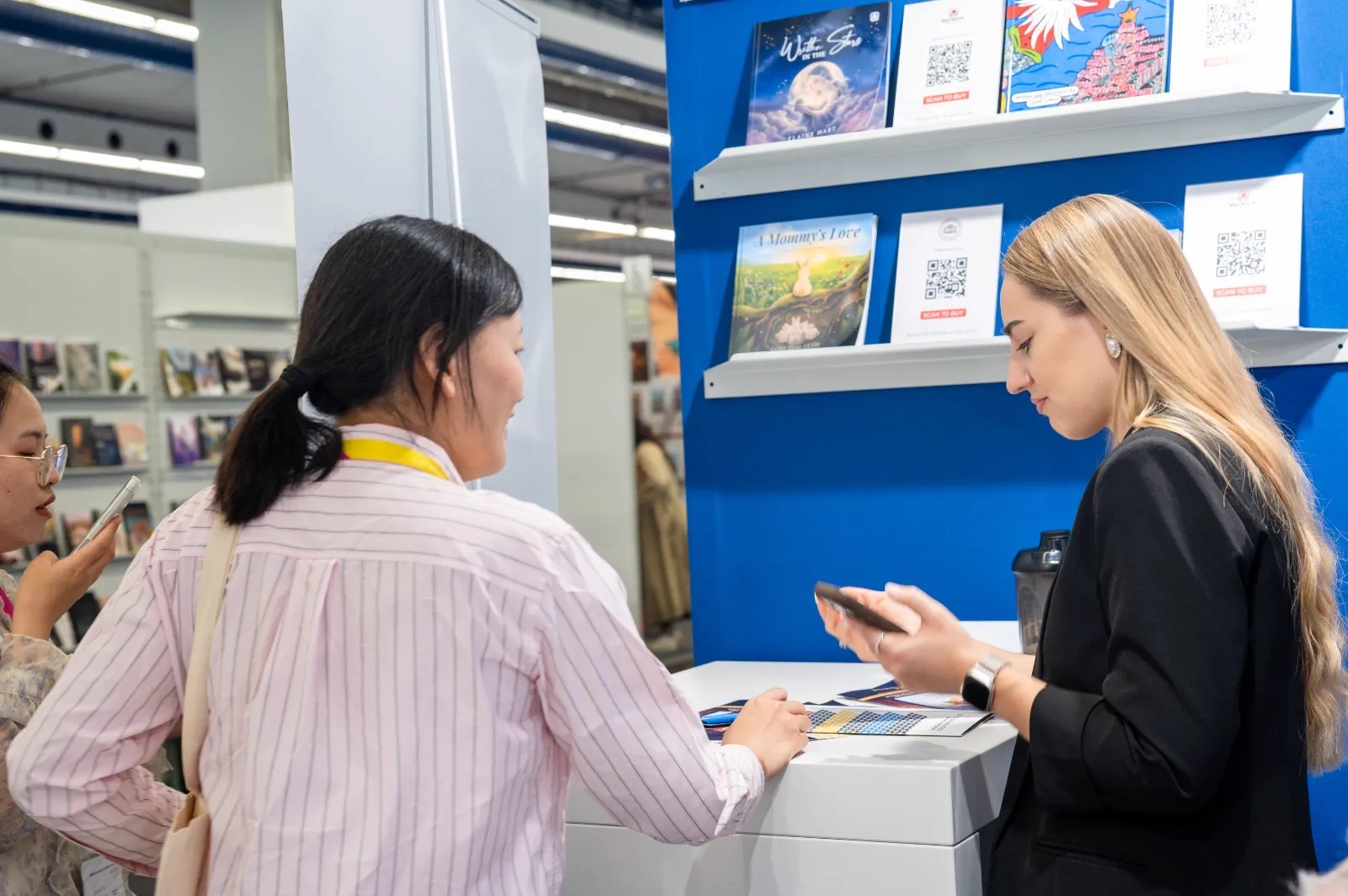 Visitors in conversation at Frankfurt Book Fair